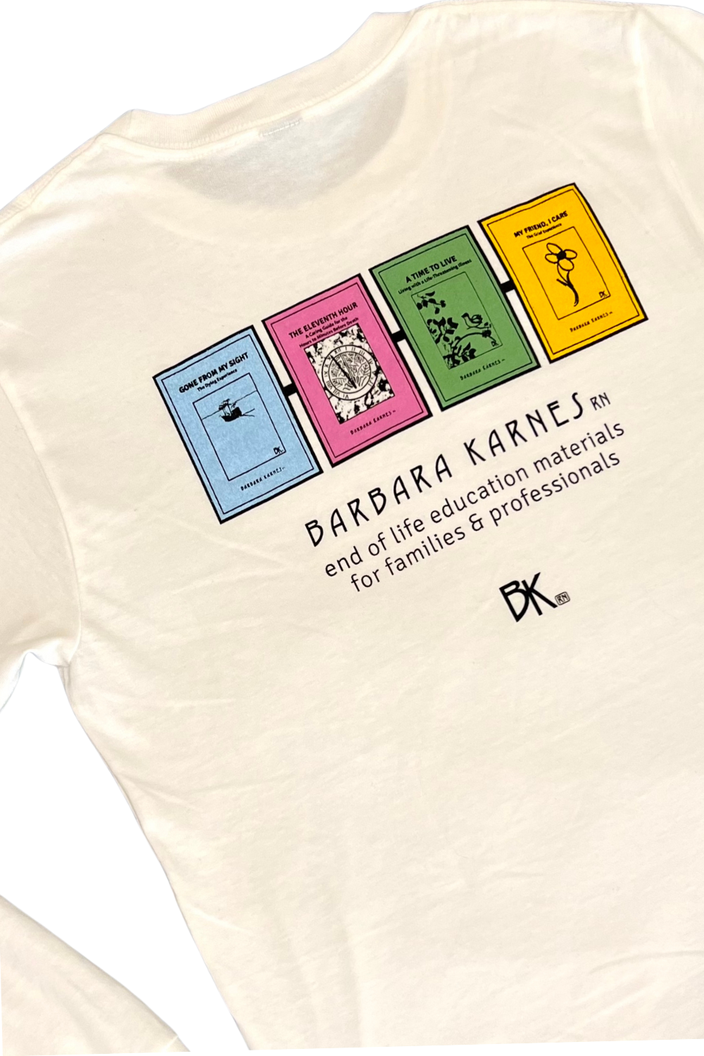 A white sweat-shirt backside with text that says Barbara Karnes, RN  end of life education materials for families and professionals along with images of four booklets including Gone From My Sight.